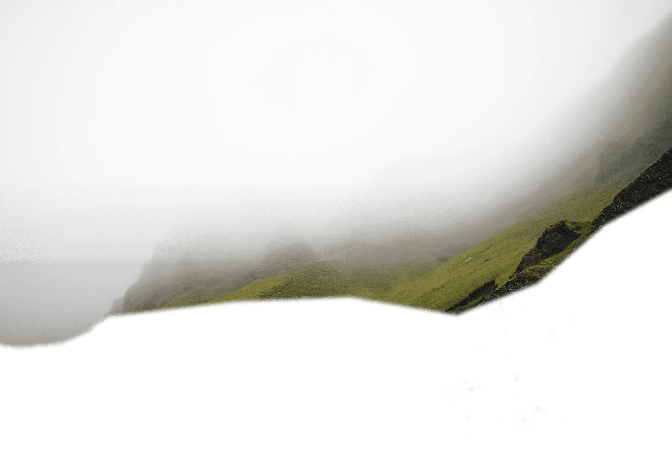 A ridge of mountains behind low cloud